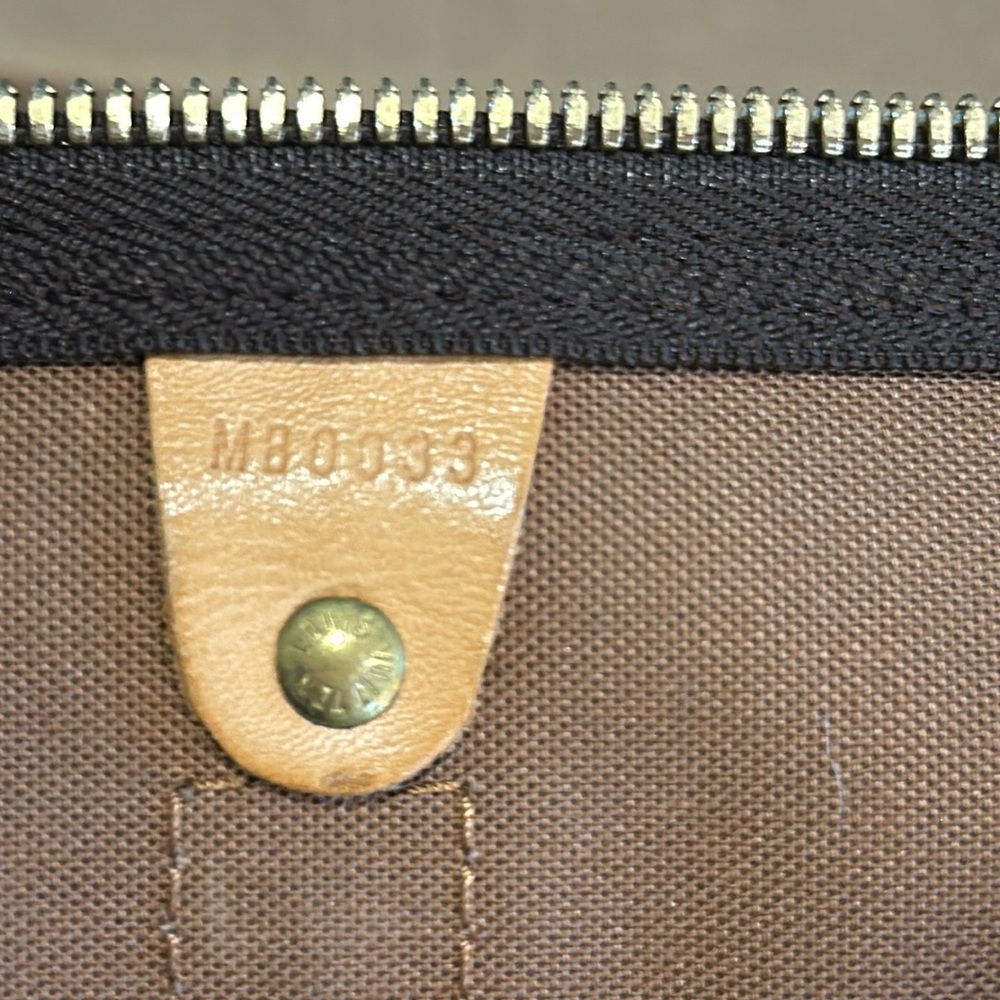 LV DUFFLE BAG WITH DATE STAMP OF MB0033 - MADE IN FRANCE 3RD WEEK OF 2003.